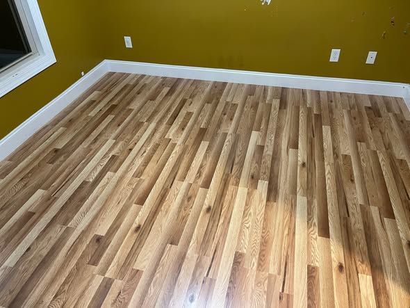 Finished bedroom floor with new baseboards