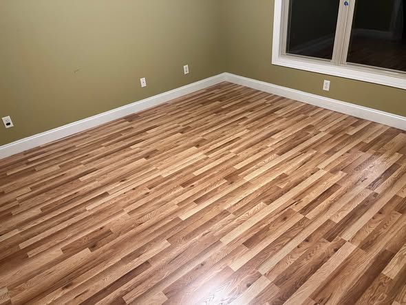 Bedroom with new hardwood-look flooring installed