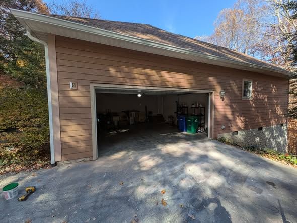 Garage front after new siding and trim