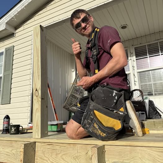 Justin framing a front porch