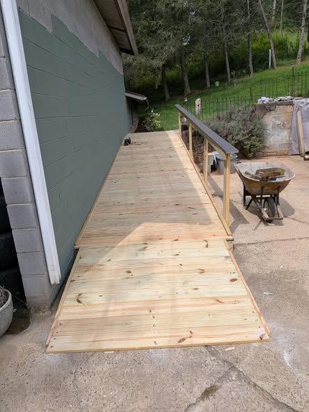 Finished wooden ramp with a handrail
